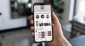 A Close-Up View Of A Smartphone Screen Displaying The Modern, Intuitive Booking Interface Of The Glowhives Platform For A Tattoo Studio.