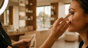 A Close-Up Demonstrating Concentrated Artistry As A Beautician Captures Professional Portfolio Content, Emphasizing High-End Service.